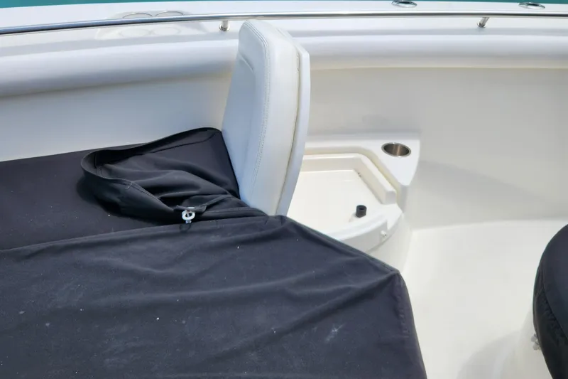 Slide: The Image of 2014 Boston Whaler 350 Outrage boat interior seating and storage area. - 20
