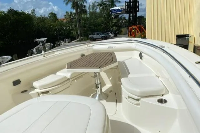 Slide: The Image of 2014 Boston Whaler 350 Outrage boat with seating and table in the bow area. - 21