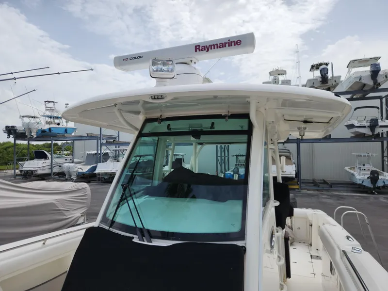 Slide: The Image of 2014 Boston Whaler 350 Outrage with Raymarine radar in a marina. - 27