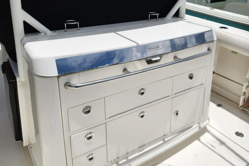 Slide: The Image of 2014 Boston Whaler 350 Outrage boat storage drawers and compartments. - 31