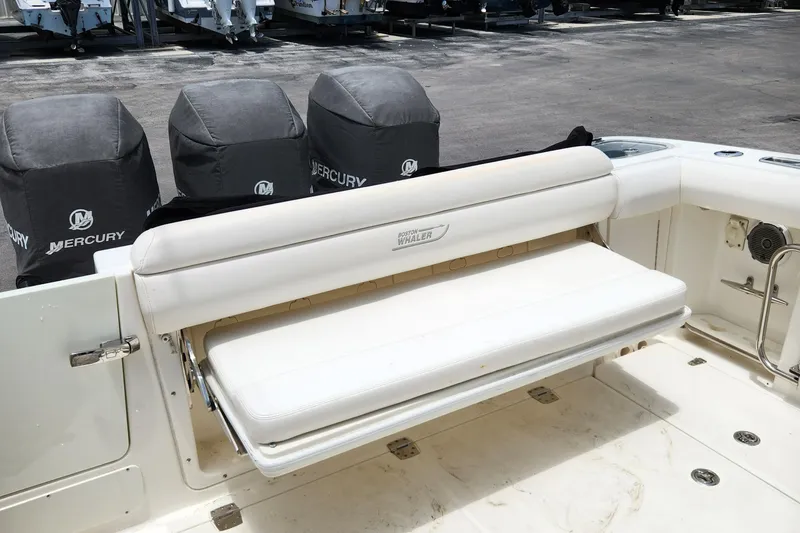 Slide: The Image of 2014 Boston Whaler 350 Outrage boat with foldable bench seat and Mercury engines. - 36