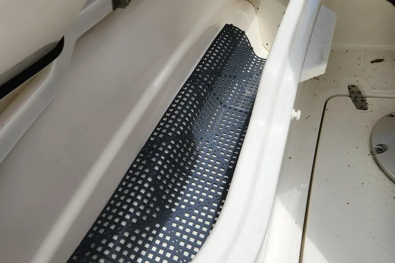 Slide: The Image of 2014 Boston Whaler 350 Outrage interior storage compartment with non-slip mat. - 44