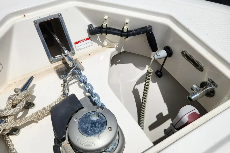 Slide: The Image of 2014 Boston Whaler 350 Outrage anchor locker with windlass and chain. - 46