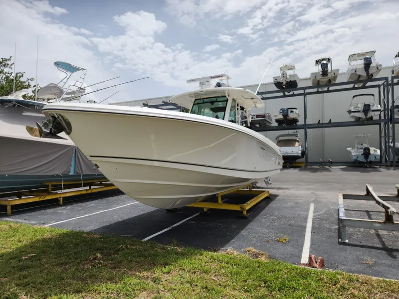 Slide: The Image of 2014 Boston Whaler 350 Outrage boat in storage yard. - 5