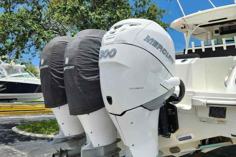 Slide: The Image of 2014 Boston Whaler 350 Outrage with triple Mercury outboard engines. - 9