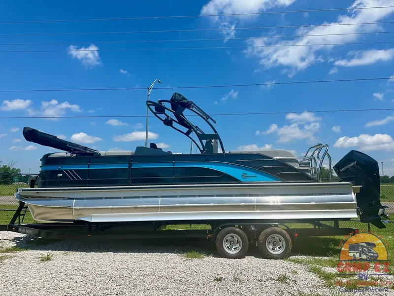 The Image of 2024 Massimo Marine T-25 Ultra Lounger pontoon boat on trailer, blue sky background. - 0