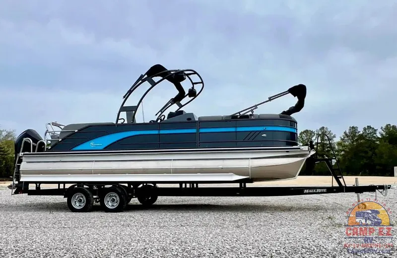 Slide: The Image of 2024 Massimo Marine T-25 Ultra Lounger pontoon boat on a trailer. - 5
