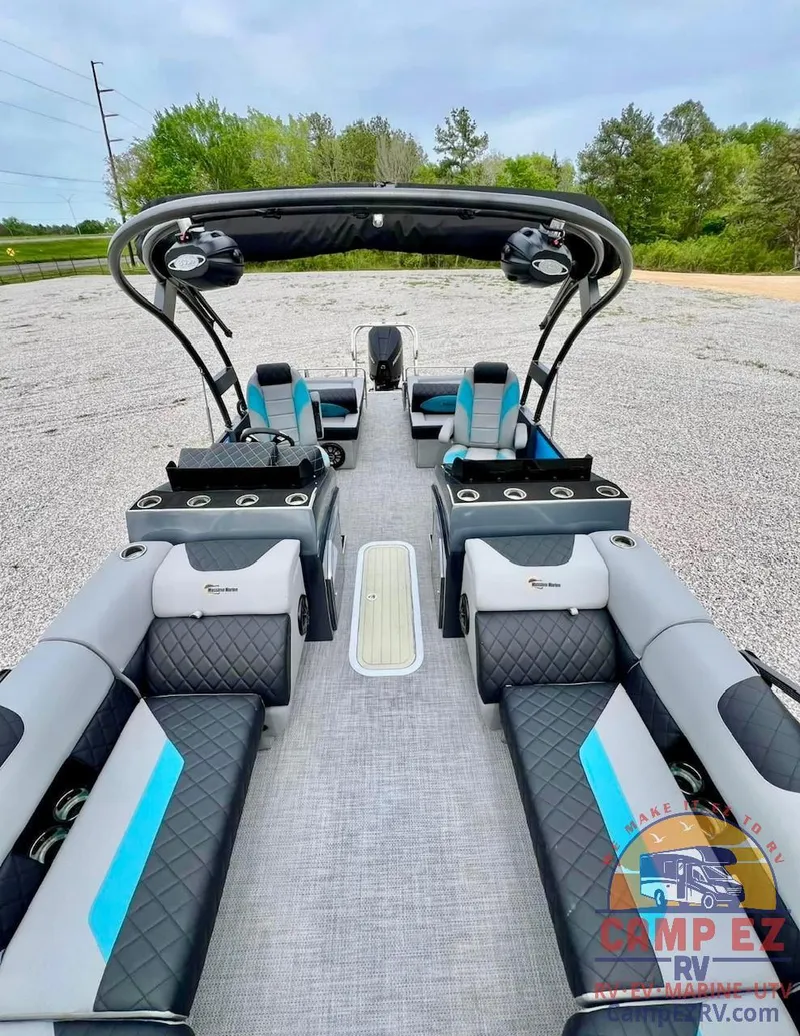 Slide: The Image of 2024 Massimo Marine T-25 Ultra Lounger pontoon boat with spacious seating and modern design. - 7