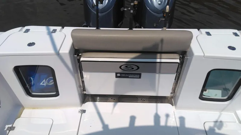 Slide: The Image of 2022 Sportsman Open 302 Center Console boat with dual engines and seating. - 10