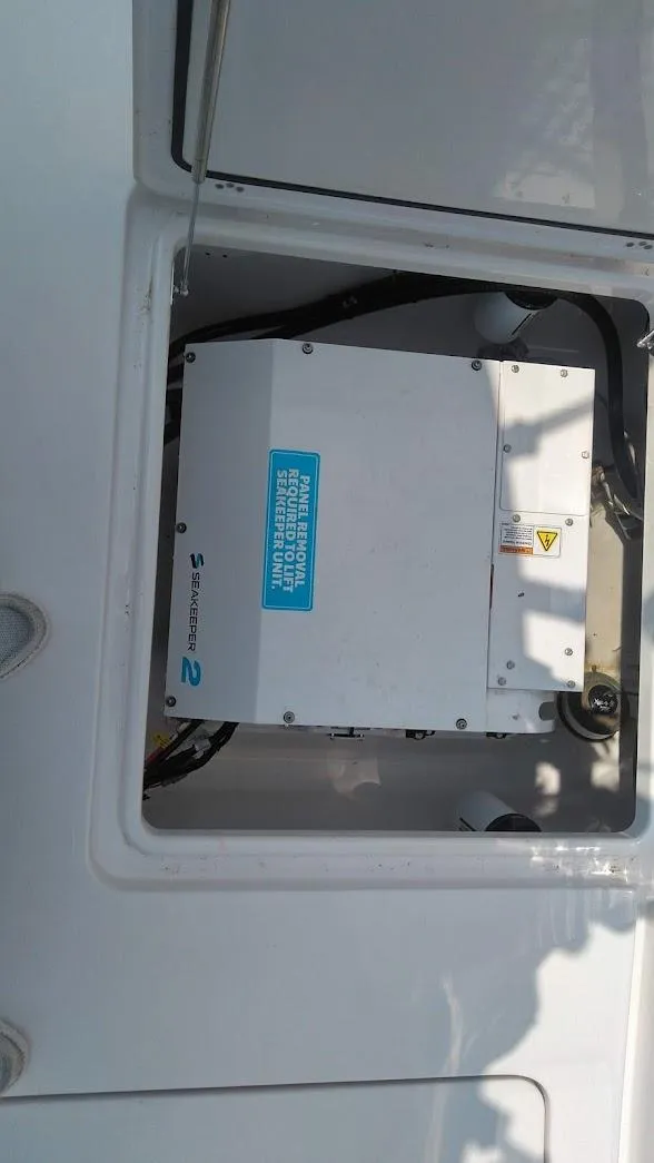 Slide: The Image of 2022 Sportsman Open 302 Center Console electrical compartment. - 11