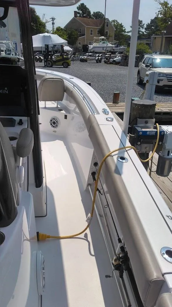Slide: The Image of 2022 Sportsman Open 302 Center Console boat docked, side view. - 13