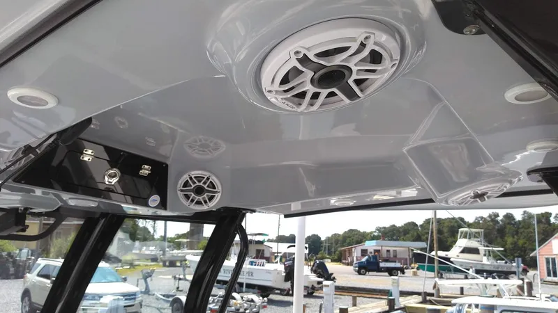 Slide: The Image of 2022 Sportsman Open 302 Center Console boat interior with speakers and control panel. - 14