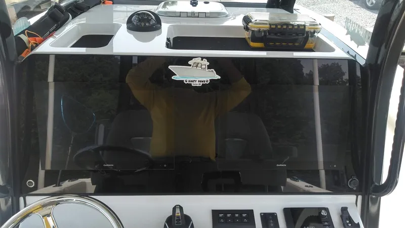 Slide: The Image of 2022 Sportsman Open 302 Center Console dashboard with steering wheel and controls. - 15