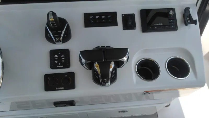 Slide: The Image of Control panel of a 2022 Sportsman Open 302 Center Console boat. - 16