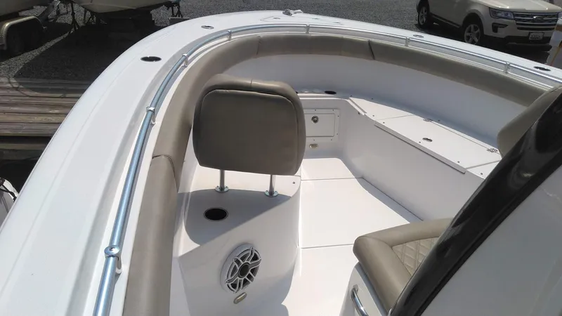 Slide: The Image of 2022 Sportsman Open 302 Center Console boat interior with seating and speaker. - 20