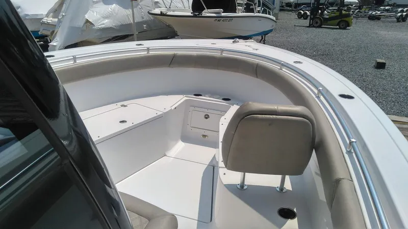 Slide: The Image of 2022 Sportsman Open 302 Center Console boat interior with seating and storage compartments. - 21