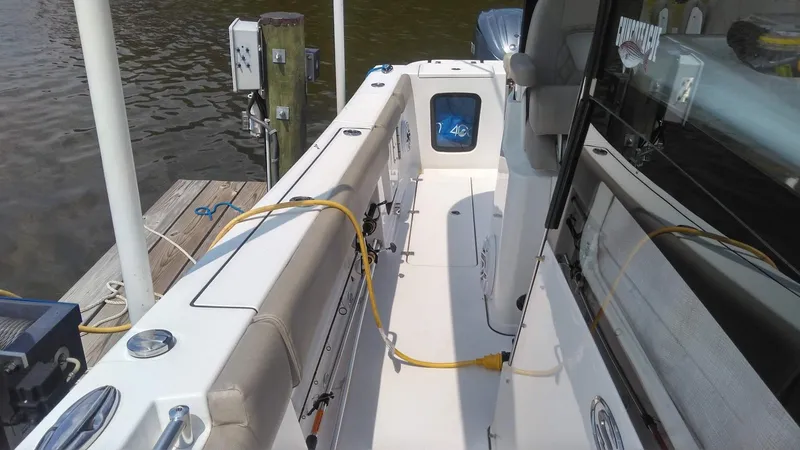 Slide: The Image of 2022 Sportsman Open 302 Center Console boat docked, interior view. - 23