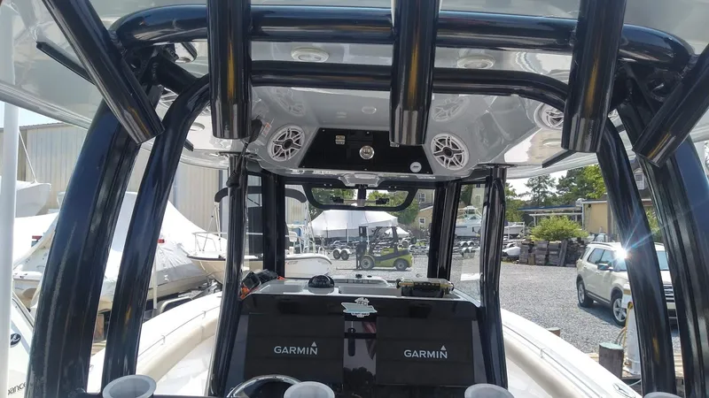 Slide: The Image of 2022 Sportsman Open 302 Center Console boat with Garmin electronics. - 3