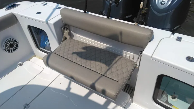 Slide: The Image of 2022 Sportsman Open 302 Center Console boat with cushioned seating. - 8