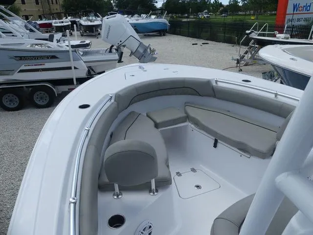 Slide: The Image of 2021 Sportsman Open 212 Cc boat with cushioned seating and storage compartments. - 10