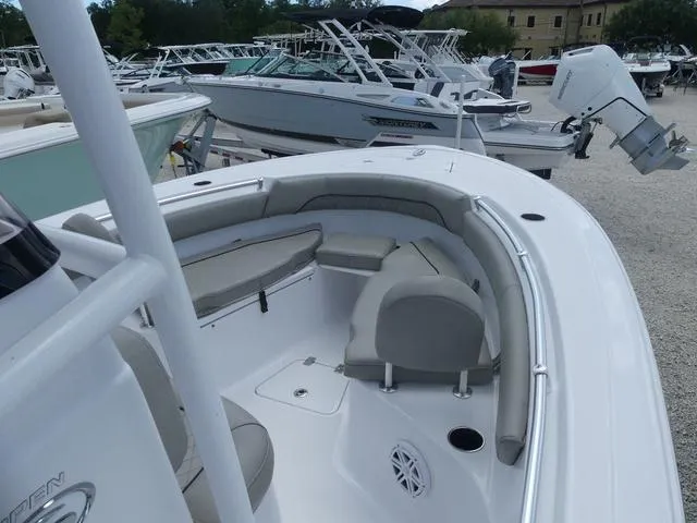 Slide: The Image of 2021 Sportsman Open 212 CC boat interior with seating and storage. - 11