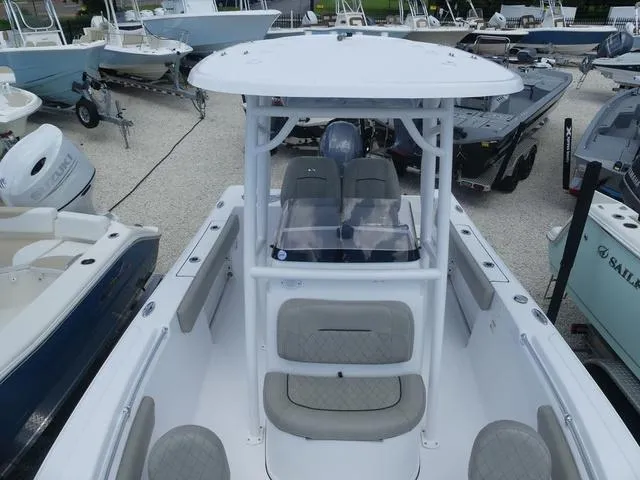 Slide: The Image of 2021 Sportsman Open 212 CC center console boat in a marina. - 12