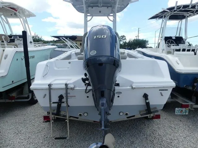 Slide: The Image of 2021 Sportsman Open 212 Cc boat with 150 HP engine, rear view. - 5