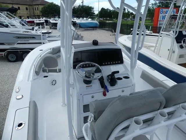 Slide: The Image of 2021 Sportsman Open 212 CC boat dashboard and seating area. - 7