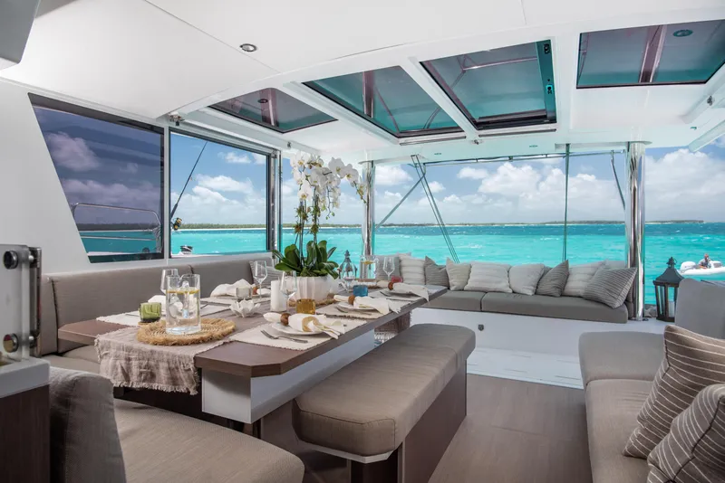 Slide: The Image of Luxurious interior of 2021 Bali 4.8 yacht with ocean view and elegant dining setup. - 15