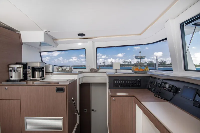 Slide: The Image of Interior of 2021 Bali 4.8 yacht with modern kitchen and navigation controls. - 18