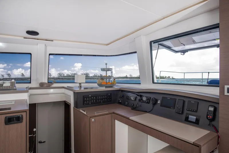 Slide: The Image of Interior view of 2021 Bali 4.8 yacht cockpit with navigation equipment and ocean view. - 19