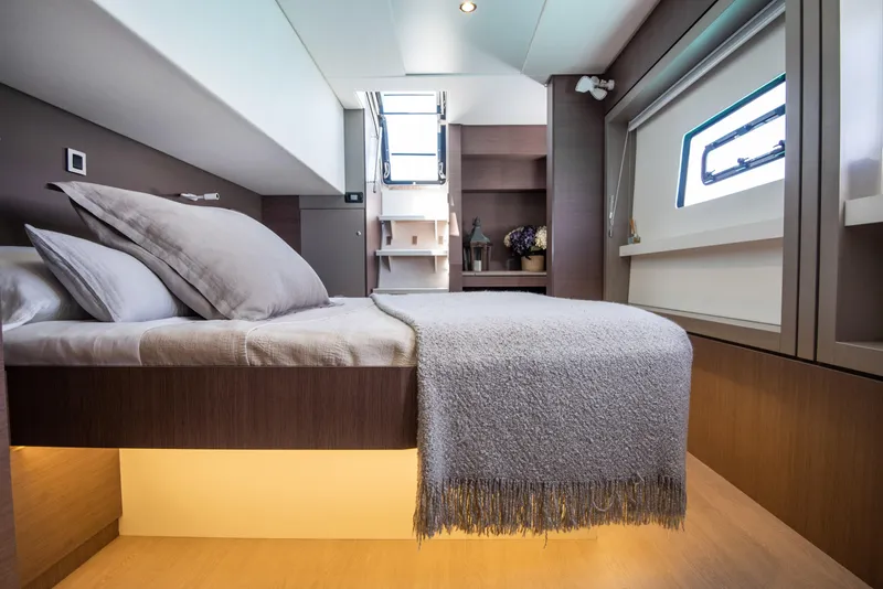 Slide: The Image of Luxurious cabin interior of 2021 Bali 4.8 yacht with modern bedding and natural light. - 23