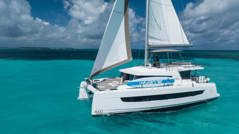 Slide: The Image of Sailing catamaran Bali 4.8, 2021 model, cruising in clear turquoise waters. - 5