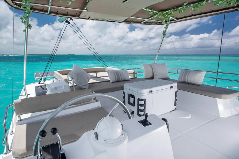 Slide: The Image of Luxurious Bali 4.8 yacht interior with ocean view, featuring comfortable seating and modern design. - 9