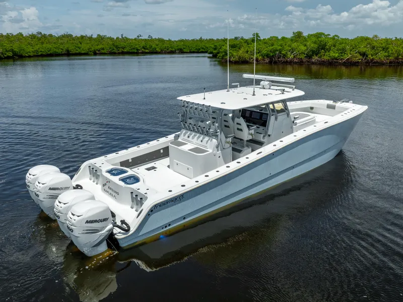 Slide: The Image of 2019 Freeman 42 LR boat with twin Mercury engines on calm water. - 10
