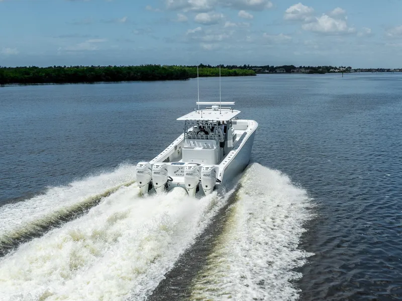 Slide: The Image of 2019 Freeman 42 LR boat cruising on a river. - 19