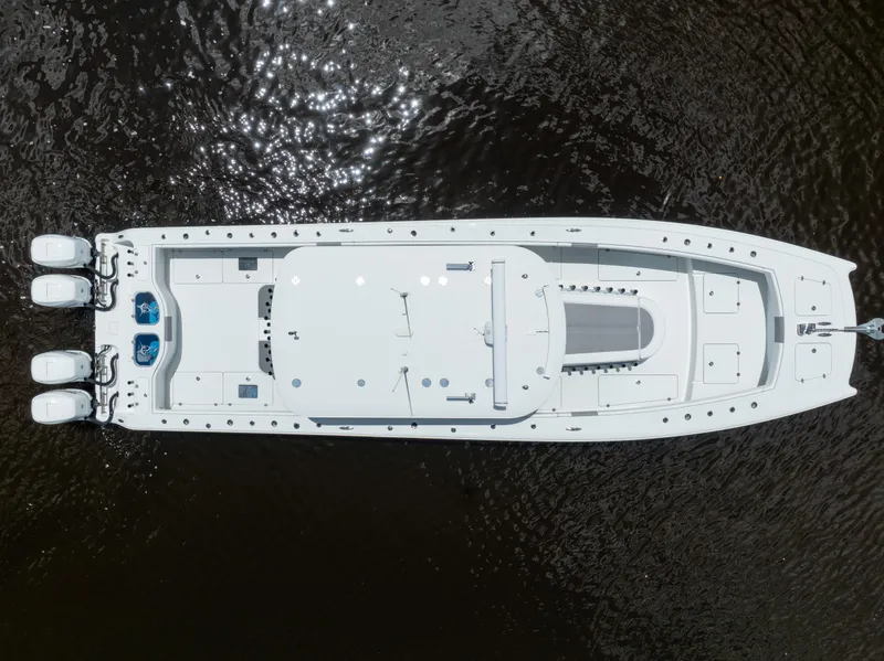 Slide: The Image of Aerial view of a 2019 Freeman 42 LR boat on water. - 21