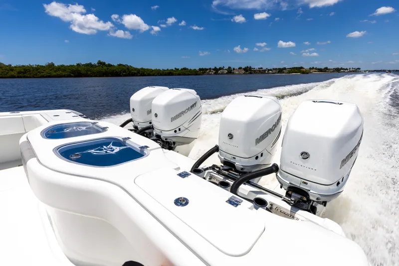 Slide: The Image of 2019 Freeman 42 LR boat with powerful outboard engines cruising on a sunny day. - 22