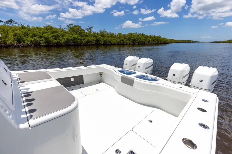 Slide: The Image of 2019 Freeman 42 LR boat with quad engines on a calm river. - 26
