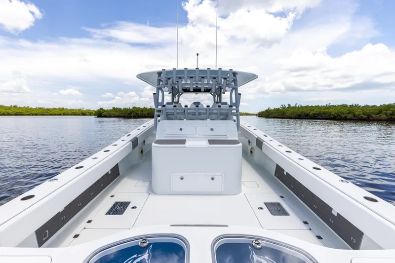 Slide: The Image of 2019 Freeman 42 LR boat on calm water with clear sky. - 27