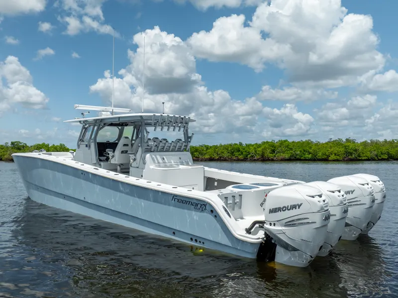 Slide: The Image of 2019 Freeman 42 LR boat with Mercury engines on calm water. - 3