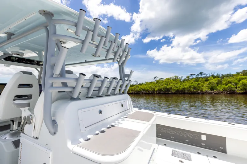 Slide: The Image of 2019 Freeman 42 LR boat with rod holders on a sunny day. - 31