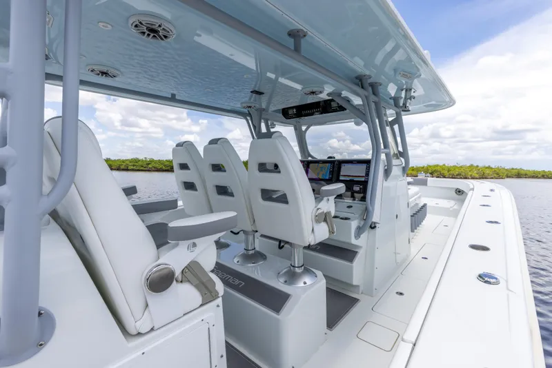 Slide: The Image of 2019 Freeman 42 LR boat interior with white seating and advanced navigation system. - 35
