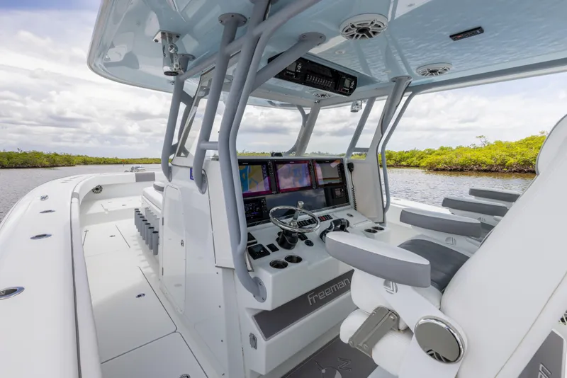 Slide: The Image of 2019 Freeman 42 LR boat cockpit with advanced navigation system. - 38