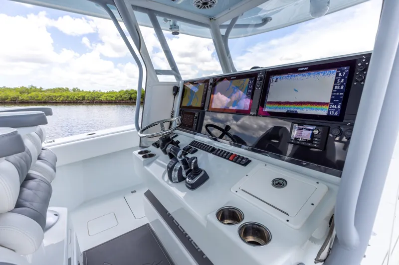 Slide: The Image of 2019 Freeman 42 LR boat cockpit with advanced navigation and control systems. - 39