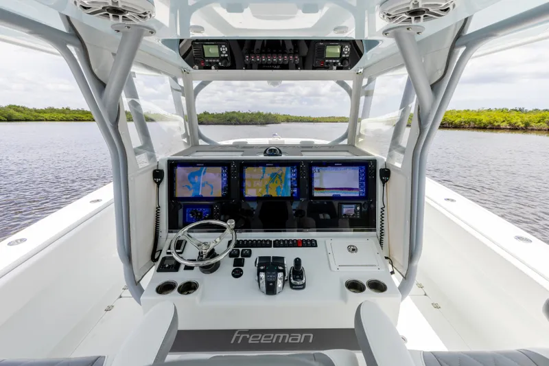 Slide: The Image of 2019 Freeman 42 LR boat cockpit with advanced navigation systems and controls. - 40