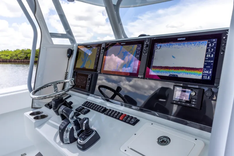 Slide: The Image of Control panel of a 2019 Freeman 42 LR boat with navigation and fish-finding equipment. - 41