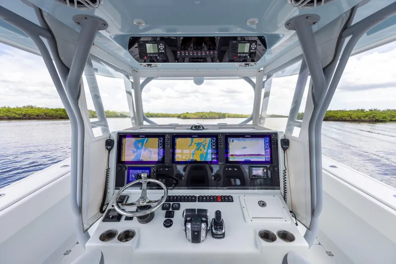 Slide: The Image of 2019 Freeman 42 LR boat cockpit with advanced navigation systems and controls. - 42