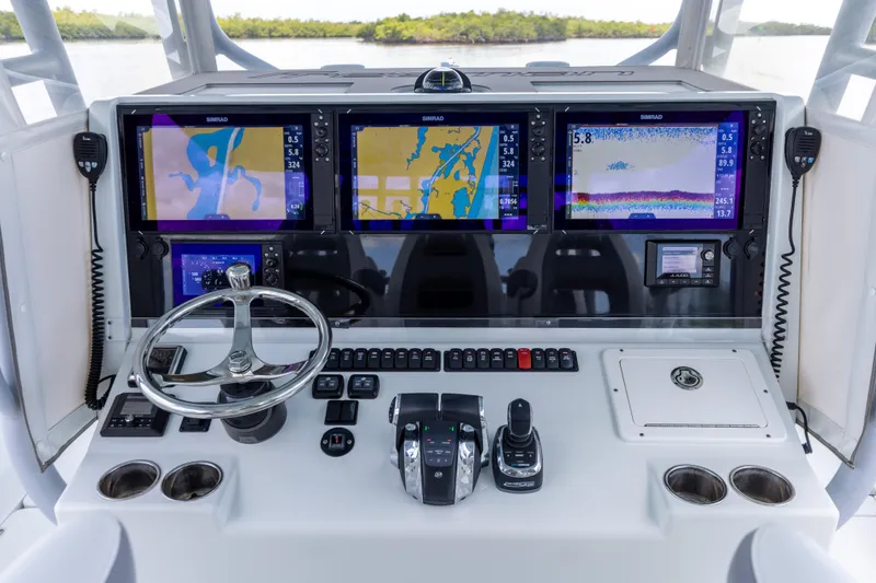 Slide: The Image of 2019 Freeman 42 LR boat dashboard with navigation screens and controls - 45