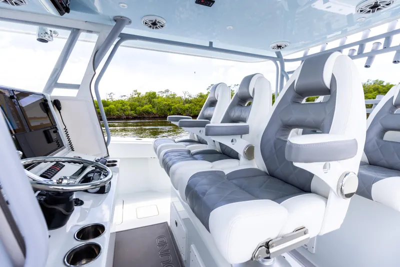 Slide: The Image of 2019 Freeman 42 LR boat interior with luxury seating and modern controls. - 49